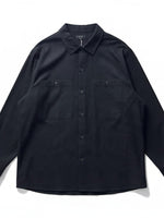 COS black long-sleeve button-down shirt in premium cotton with double chest pockets and a structured collar.