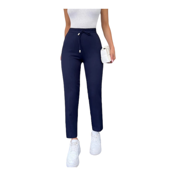 A pair of navy slim fit straight leg pants with an elastic waistband, featuring a white top and white sneakers.