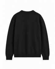 COS black long sleeve sweater in a wool and silk blend with ribbed cuffs and neckline.