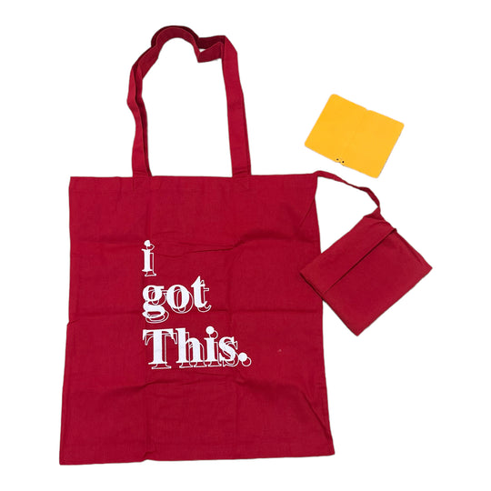 A red cotton tote bag with the text 'i got This' printed on the front, accompanied by a foldable pocket and a yellow tag.