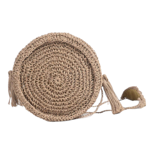 A brown woven raffia round sling bag with a zipper and a tassel detail.