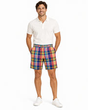 Model wearing GANT multicolor plaid cotton cargo shorts with a white polo shirt and sneakers