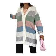 Person wearing a colorful striped cardigan holding a pink bag on a white background