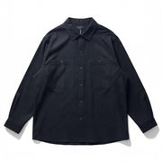 COS black long-sleeve button-down shirt in premium cotton with double chest pockets and a structured collar.