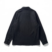 Back view of a COS black long-sleeve button-down shirt made from premium cotton with a structured collar.