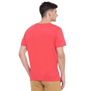 Back view of model wearing GANT pink logo T-shirt with plain back design
