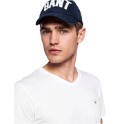 Close-up of GANT white V-neck T-Shirt showing embroidered logo and fine stitching details.