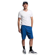 Full body front view of model wearing GANT white V-neck T-Shirt paired with blue shorts and sneakers.