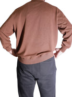 The Discount District men's brown virgin wool sweater with ribbed cuffs and hem, back view.