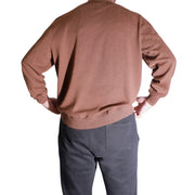 The Discount District men's brown virgin wool sweater with ribbed cuffs and hem, back view.