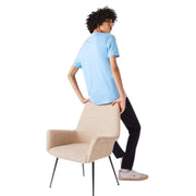 Rear angle view of Lacoste light blue V-neck T-Shirt on model with curly hair