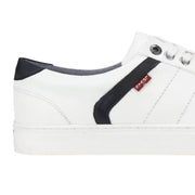 Close-up of Levi's white sneaker side profile – textured white sole and stitched panel with navy contrast