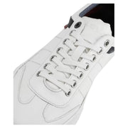 Detailed view of Levi's sneaker lacing system – white laces with metal eyelets on navy-trimmed tongue