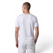 Back view of a man wearing a white Nautica cotton V-neck t-shirt from The Discount District, featuring a clean design.