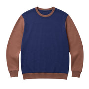 The Discount District men's navy and brown virgin wool sweater with ribbed cuffs and a comfortable crew neckline.