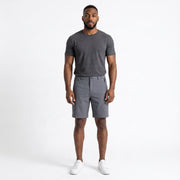 The Discount District men's dark brown cotton chino shorts with zip pockets and regular fit, worn by a model.