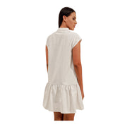 The Discount District off-white linen mini dress with a collared neckline and flowy drop-waist skirt, back view.