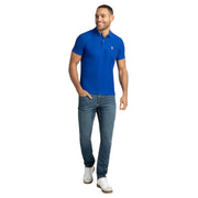 US Polo Assn. royal blue polo shirt styled with jeans - front full body view